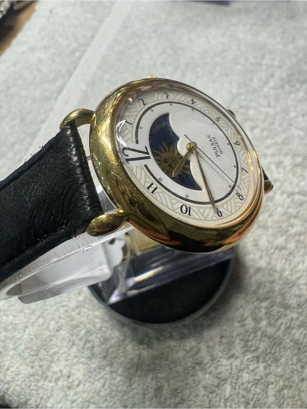 Pulsar Gold Tone Watch with White Dial and Black Strap